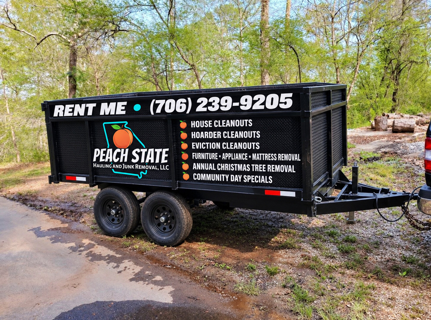 Mockup of Peach State Hauling black 10-yard dump trailer with branded vinyl